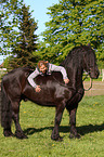 woman with Friesian horse