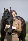 woman and Frisian horse