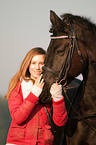 girl and Friesian horse