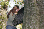 woman and Frisian horse