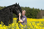 woman and Friesian horse