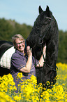 woman and Friesian horse