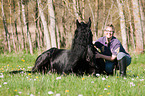 woman and Friesian horse