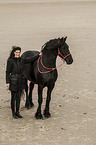 woman and Frisian Horse