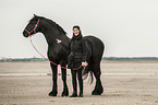 woman and Frisian Horse