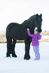 girl and Friesian Horse