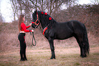 woman with Friesian Horse