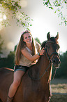 woman and German Riding Pony