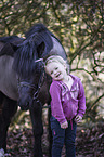 German Riding Pony with a child