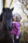 German Riding Pony with a child