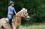 woman rides Haflinger