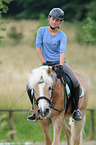 woman rides Haflinger