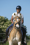 woman rides Haflinger