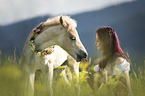 woman and Haflinger foal