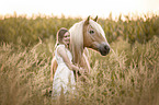 woman and Haflinger