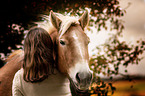 woman and Haflinger horse