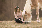 woman and Haflinger horse