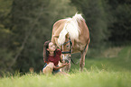 woman and Haflinger horse