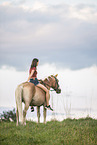 woman and Haflinger horse