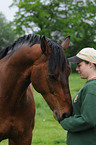 woman with Hannoveraner horse