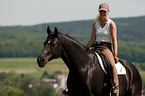 woman rides Hanoverian