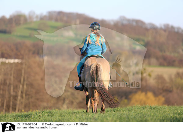 woman rides Icelandic horse / PM-07804