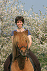 woman rides Icelandic horse