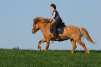 woman rides Icelandic horse