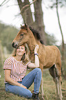 woman and Icelandic horse foal