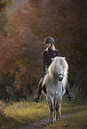 woman rides Icelandic horse