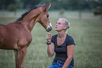 woman and Oldenburg Horse foal