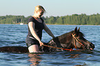 woman rides pony