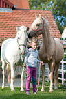 girl and ponies
