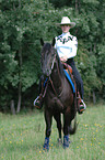 woman rides Quarter Horse