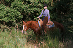 woman rides Quarter Horse