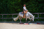 woman rides Quarter Horse