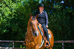 woman rides Quarter Horse