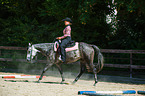 woman rides Quarter Horse