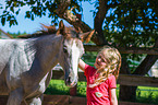 child and Quarter Horse
