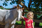 child and Quarter Horse