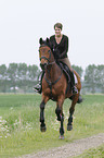 woman rides Trakehner