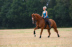 woman rides warmblood