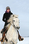 woman rides warmblood