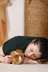 young woman with guinea pig