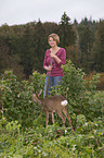 woman and young roe deer