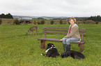woman with dogs an roe deer